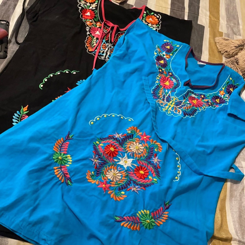 Two embroidered dresses